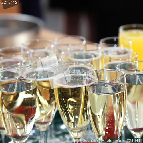 Image of Elegant flutes filled with champagne
