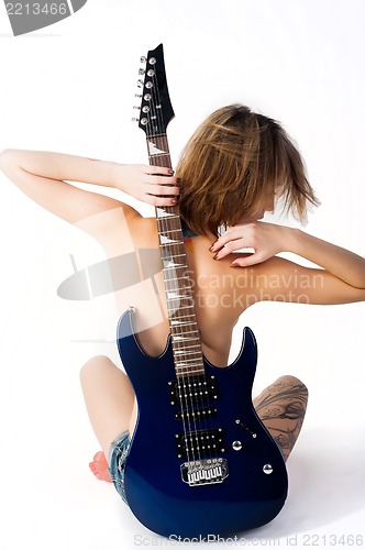 Image of beautiful woman with guitar
