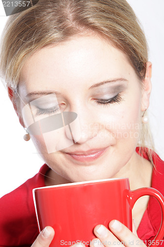 Image of Woman enjoying a mug of coffee