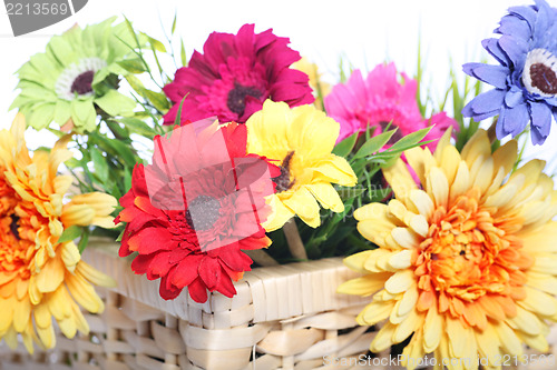 Image of Bright summer flowers in a basket