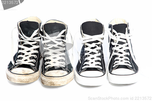 Image of Two pairs of sneakers - one old, one new