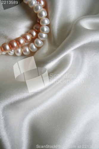 Image of Smooth elegant white silk with pearls as background