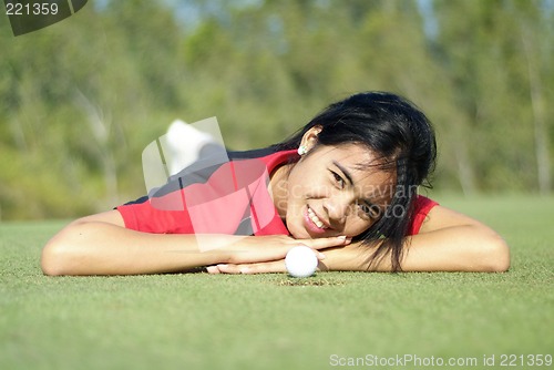 Image of Female golf player on green