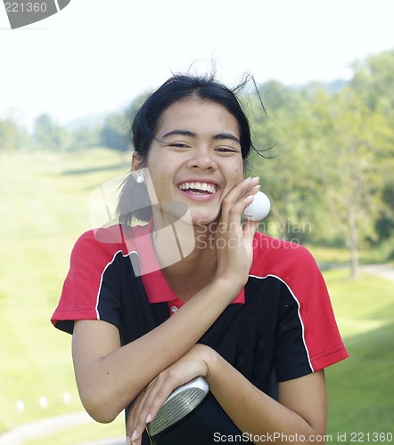 Image of Female golf player laughing