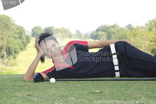 Image of Female golf player resting