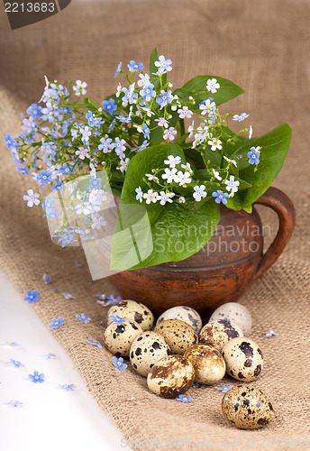 Image of quail eggs and  flowers