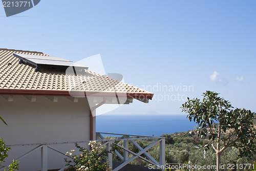 Image of house by the sea with photovoltaic system