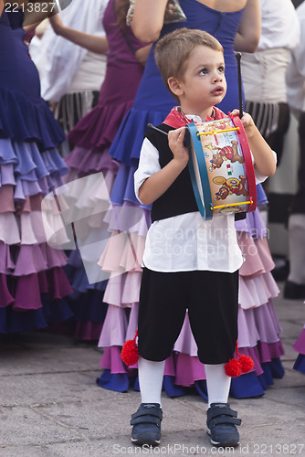 Image of child from sicilian folk group