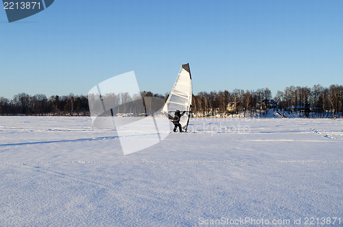 Image of ice surfer man wind sail frozen lake winter sport 