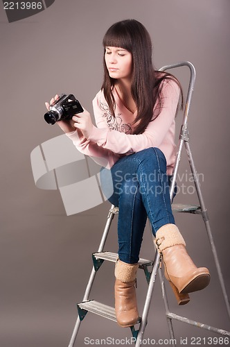 Image of young woman with video camera