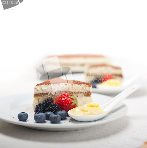 Image of tiramisu dessert with berries and cream