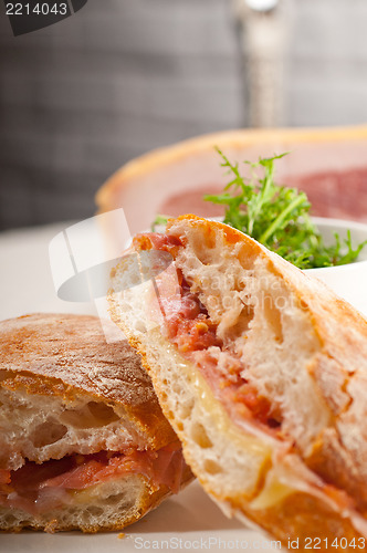 Image of ciabatta panini sandwich with parma ham and tomato