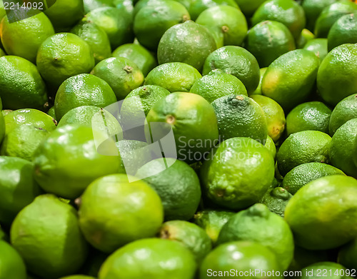 Image of green lemon  on display at farmers market