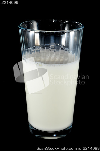 Image of glass of milk on black background