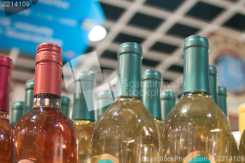 Image of Wine bottles shot with limited depth of field on display in a li