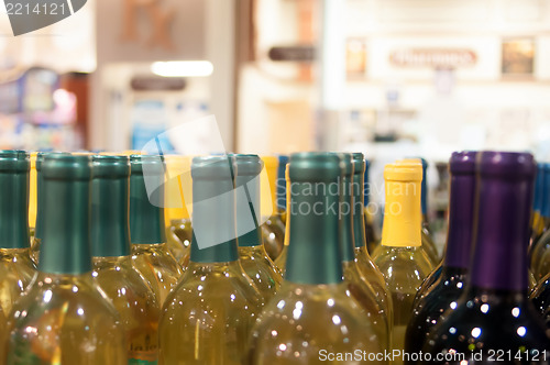 Image of Wine bottles shot with limited depth of field on display in a li