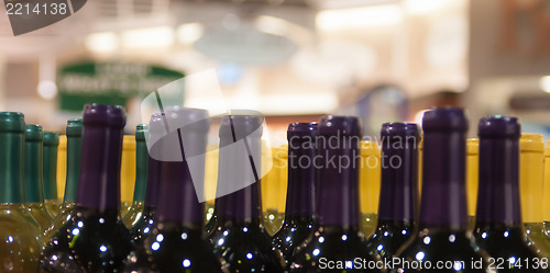 Image of Wine bottles shot with limited depth of field on display in a li