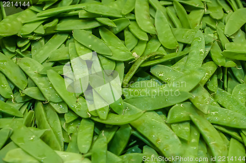 Image of Freshly harvested peas on display at the farmers market