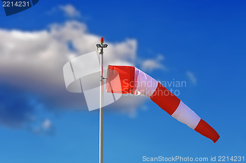 Image of windsock over blue sky