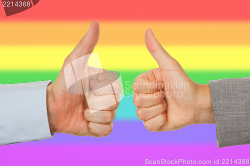 Image of Caucasian business man and woman holding thumb up