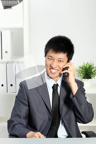 Image of Asian Businessman Talking on Cellphone