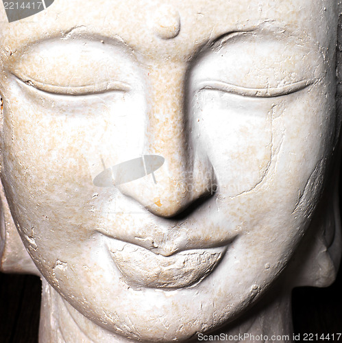 Image of Serene face of a stone Buddha
