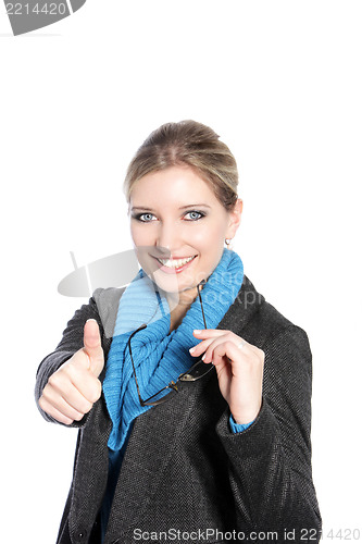 Image of Woman in winter attire giving a thumbs up