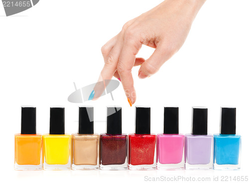 Image of Female hand fingers are the colored paints polish