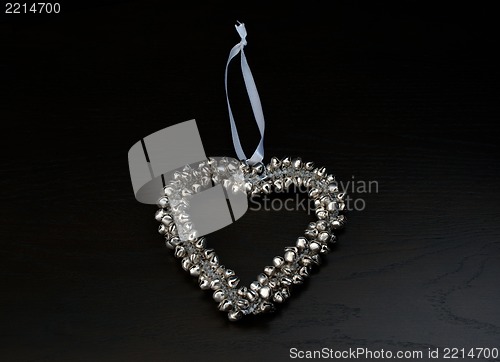 Image of decoration: silver bells forming a heart