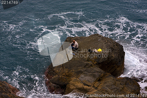 Image of fisherman abstract rock  