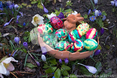 Image of Easter basket amongst spring crocus flowers