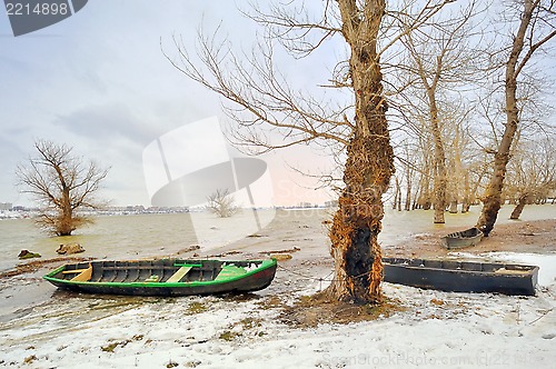Image of green boat on shore in winter