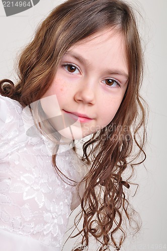 Image of pretty 8 year old girl in white dress