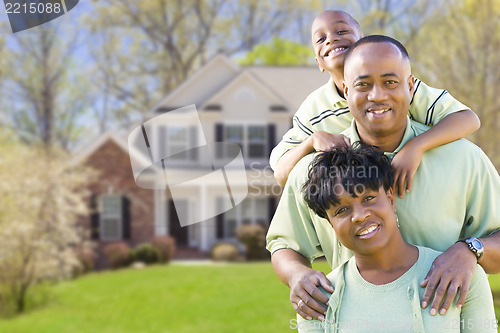 Image of African American Family In Front of Beautiful House
