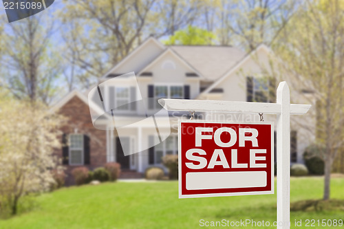 Image of Home For Sale Real Estate Sign and House