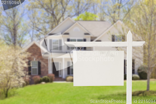 Image of Blank Real Estate Sign in Front of New House 