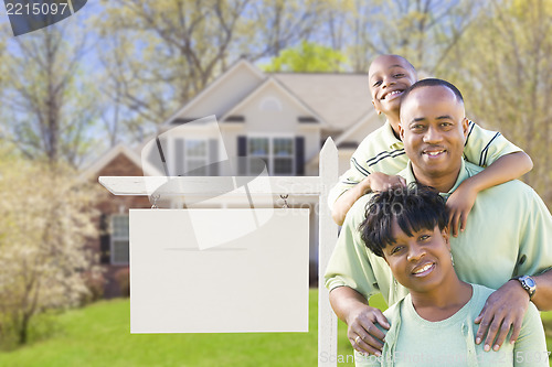 Image of African American Family In Front of Blank Real Estate Sign and H
