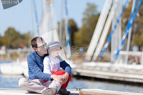 Image of family at a marina dock