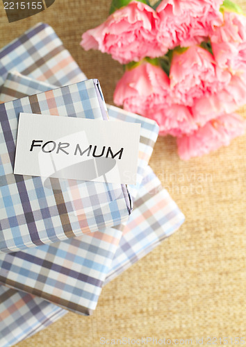 Image of Gift and pink carnations flower for Mother's Day