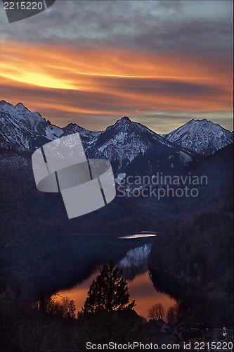 Image of sun snow mountain and lake 