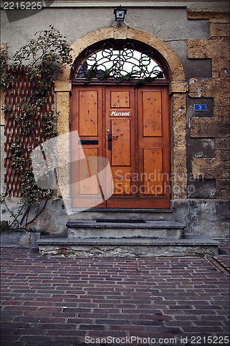 Image of   brown door and grate  in  bellinzona 
