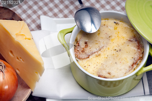 Image of onion soup with melted cheese and bread on top