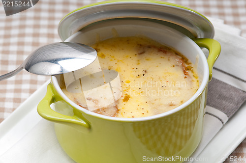Image of onion soup with melted cheese and bread on top