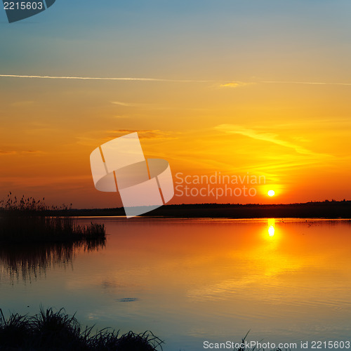 Image of red sunset over river