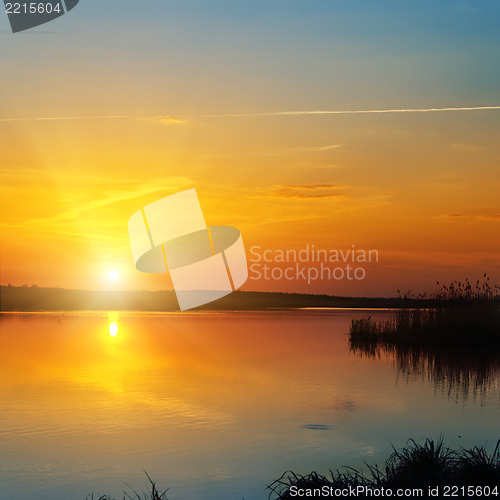 Image of red sunset over river