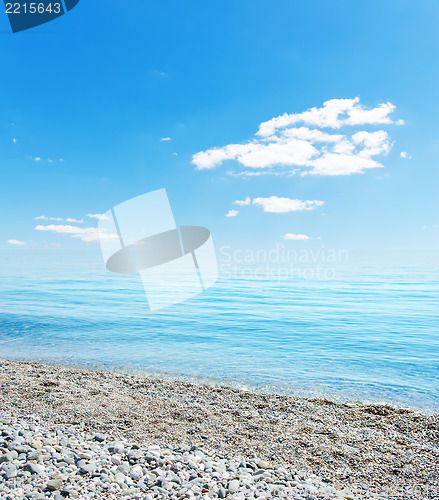 Image of stones on beach, sea and blue sky. Crimea, Ukraine