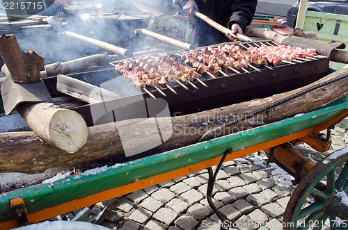 Image of man hand fork bake pork meat fire outdoor food 