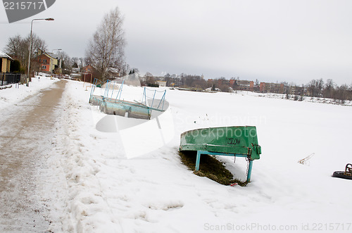 Image of dock barrel wooden upturn boat snow season winter 