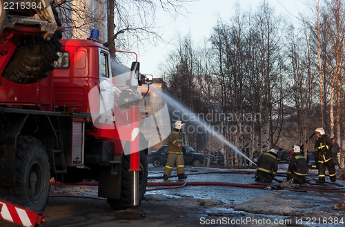 Image of Firefighters extinguish a fire