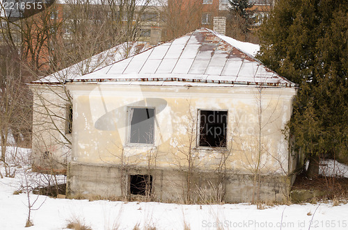 Image of old brick house broken windows winter snow 